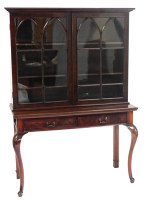 Lot 694 - A George III mahogany bookcase, with an...