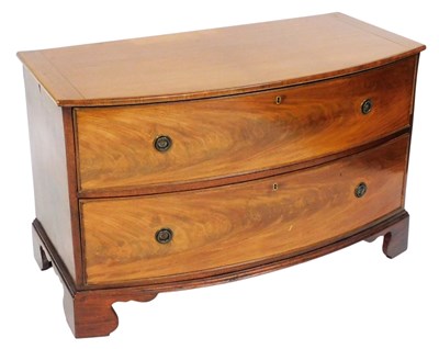 Lot 701 - A George III mahogany bow front chest, of two...