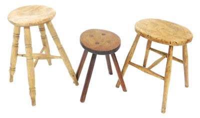 Lot 711 - A late 19thC elm milking stool, raised on...