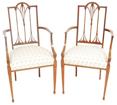 Lot 776 - A pair of Edwardian satinwood carver chairs,...