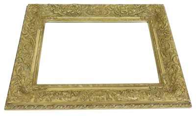 Lot 799 - A simulated light wood plaster wall mirror, of...