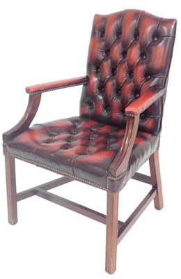 Lot 811 - A Georgian style oxblood red leather armchair,...