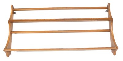 Lot 810 - An Ercol elm hanging plate rack, 52cm x 97cm.