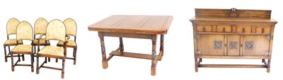 Lot 770 - An early 20thC oak dining suite, comprising a...