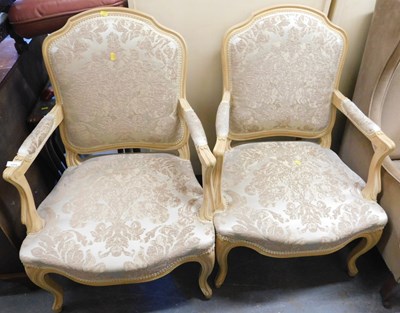Lot 1005 - A pair of 20thC open armchairs in the French...