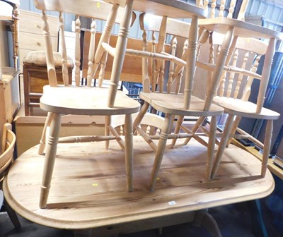 Lot 1009 - A pine dining table, the lozenge top with a...