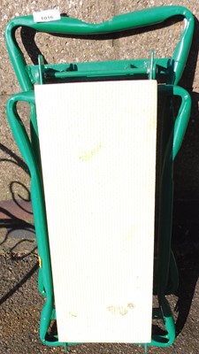 Lot 1016 - A folding garden kneeler.