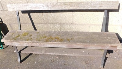 Lot 1017 - A garden bench, with wooden back and seat, on...