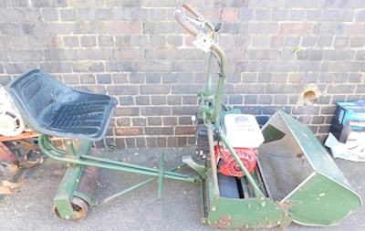 Lot 1023 - An Atco ride on petrol mower, with a Honda...
