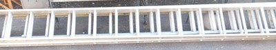 Lot 1027 - Two metal extending ladders.