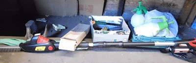 Lot 1047 - A Cobra hedge trimmer, with battery, together...