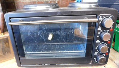 Lot 1054 - An electric mini oven, with double hot plate.