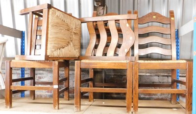 Lot 1059 - Four oak ladder back dining chairs, each with...