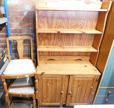 Lot 1069 - A pine dresser, the top with three shelves...
