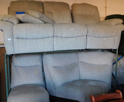 Lot 1093 - An L shaped sofa, upholstered in grey fabric,...