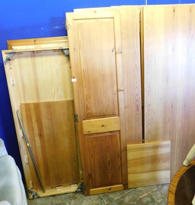 Lot 1098 - A pine wardrobe, unassembled.