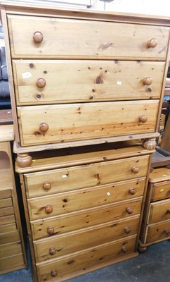 Lot 1128 - Two pine chests of drawers, comprising a three...