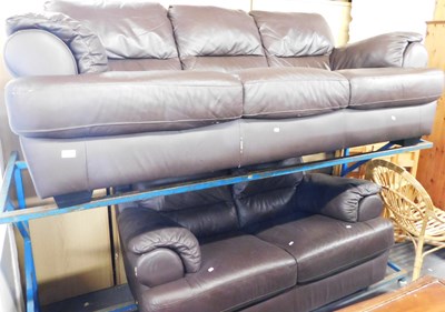 Lot 1029 - A brown leatherette three seater sofa,...