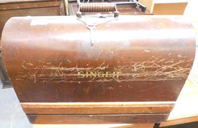 Lot 1119 - A cased Singer sewing machine.