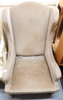 Lot 1081 - A wing back armchair, on mahogany square...