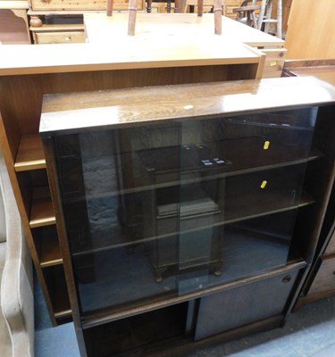 Lot 1052 - An open bookcase, together with an oak cabinet,...