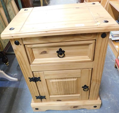 Lot 1158 - A pine bedside cupboard, the top with molded...