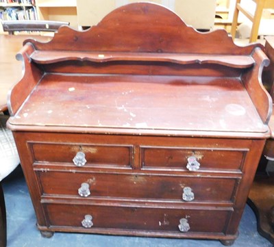 Lot 1169 - A stained pine chest, the top with a raised...