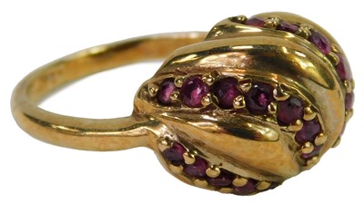 Lot 486 - A 9ct gold and ruby ring, set with four rows...