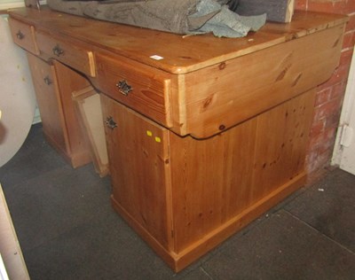 Lot 1011 - A pine twin pedestal partners desk, with three...
