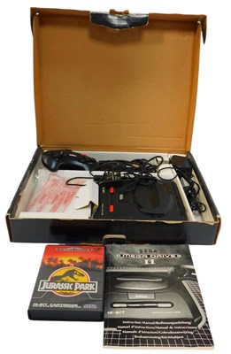 Lot 591 - A Sega Mega Drive 2, boxed, including two...