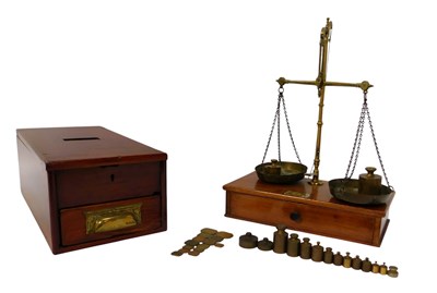 Lot 473 - A set of early brass scales, on a wooden base,...