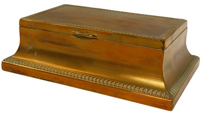 Lot 523 - An early 20thC brass cigarette box, decorated...