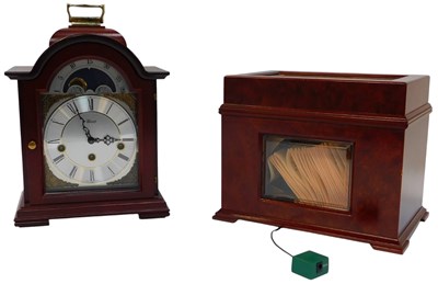 Lot 548 - A Hermle mahogany cased mantel clock, the...