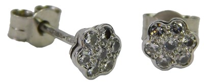 Lot 609 - A pair of diamond flower head stud earrings,...