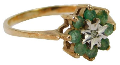 Lot 613 - A 9ct gold emerald and diamond flower head...