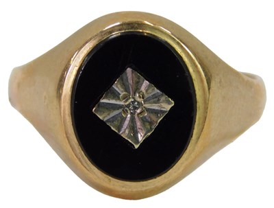 Lot 621 - A 9ct gold and black onyx signet ring, set...