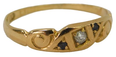 Lot 623 - An 18ct gold sapphire and diamond three-stone...