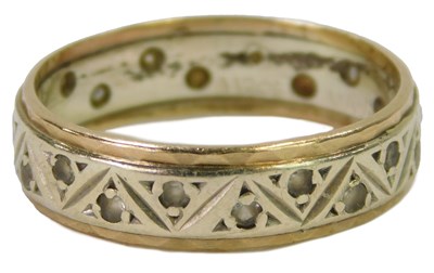 Lot 624 - An eternity band, set with white paste stones,...