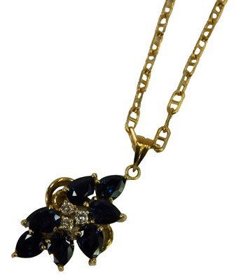 Lot 633 - A garnet drop pendant, yellow metal, marked...