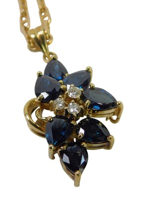 Lot 634 - A sapphire and diamond pendant, in an abstract...