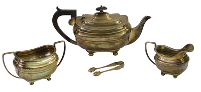 Lot 640 - A George V silver three piece tea...