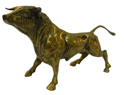 Lot 713 - A brass figure modelled as a bull, 26cm high.