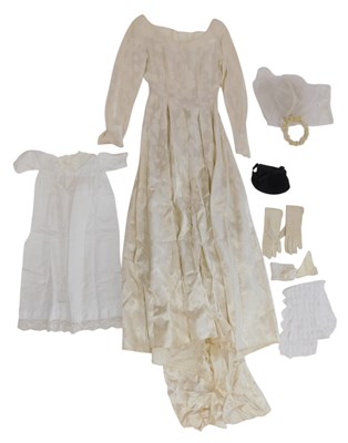 Lot 721 - A 1950s silk brocade wedding dress, waist...