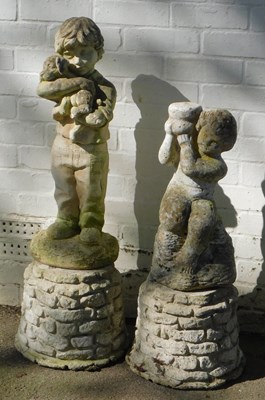 Lot 772 - Two composition stone garden statues, one...