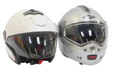 Lot 384 - A Nolan motorcycle helmet, in white, together...
