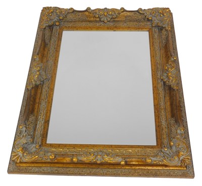 Lot 786 - A rectangular gilt wall mirror, the moulded...