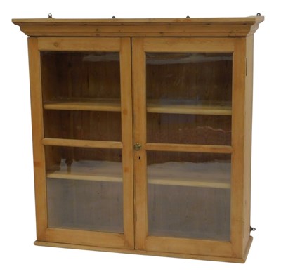 Lot 789 - A pine wall hanging bookcase, the top with a...