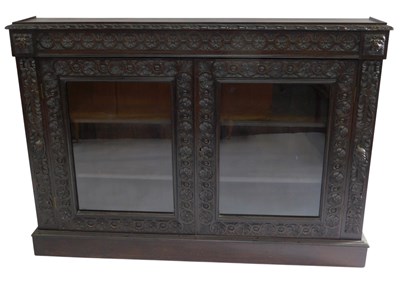 Lot 793 - A Victorian carved oak side cabinet, the top...