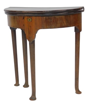 Lot 818 - An 18thC walnut tea table, the demi-lune...