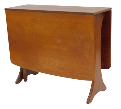 Lot 822 - A teak drop leaf table, on shaped end supports,...